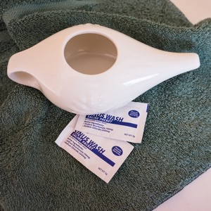 getting sinus congestion relief with saline washes using a neti pot